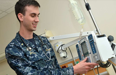 Registered nurse checks testing equipment